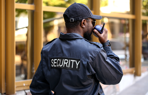 Mteki security officer on patrol using a two-way radio in the Eastern Cape