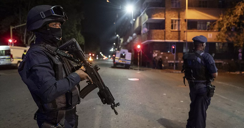 Mteki armed security officers conducting a night patrol on a South African street